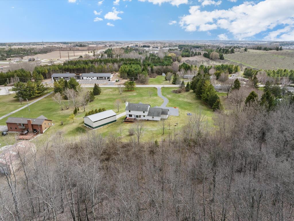 3 plus acres with wooded backdrop just outside of